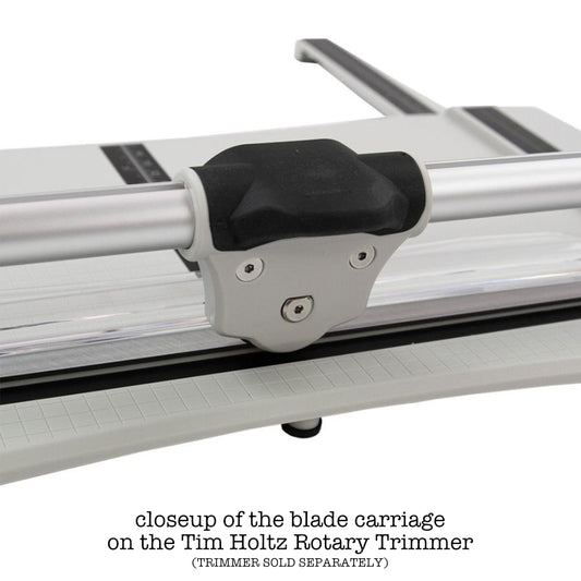 closeup of the Replacement Blade with Carriage (for the Tim Holtz Rotary Media Trimmer) - by Tim Holtz and Tonic Studio ... a spare blade for a professional trimmer designed with makers in mind for all kinds of papercraft creativity. Pack contains 1 (one) Rotary Blade Carriage, 1 (one) Allen key and instructions.