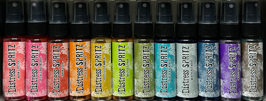 photograph of all 12 Distress spritz sprays from Tim Holtz and Ranger