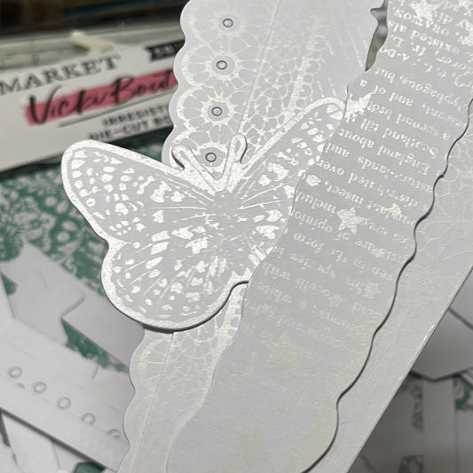 A close up photograph of the 49 and Market paper embellishments called 'Irresistable' die cuts by Vicki Boutin. Use with inks and paints to create customised scrapbooking layers for arts and crafts.