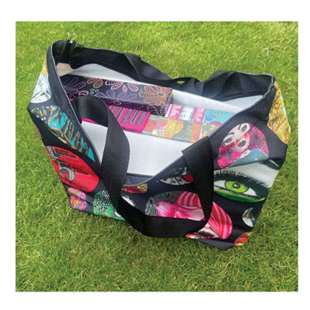 Shoulder Bag, Large Zippered Tote ... by Dyan Reaveley's Dylusions and Ranger. 
Made of the same durable and luxurious feeling printed canvas as used for the Dylusions apron (also available sold separately), this large shoulder bag features a black zipper with silver clasp, long canvas black straps and double stitching for added strength. Perfect carry-all for shopping, carrying art supplies, travelling bag or storage. Photo of the bag open with boxes inside (not included).