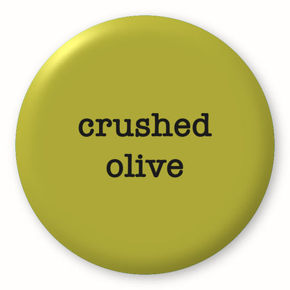Crushed Olive - Tim Holtz Distress by Ranger - Image of a round spot with the colour name in the centre. To coincide with your choice of colour when purchasing Distress Paint, Spray Stain, Oxide Spray, Ink Pad, Oxide Ink Pad, Reinker, Oxide Reinker, Embossing Glaze, or Archival Reinker from Art by Jenny Online Shop in Australia. Please note, while we have taken care to show a close representation, the colour may vary between screens or different mediums (inks, oxides, etc).