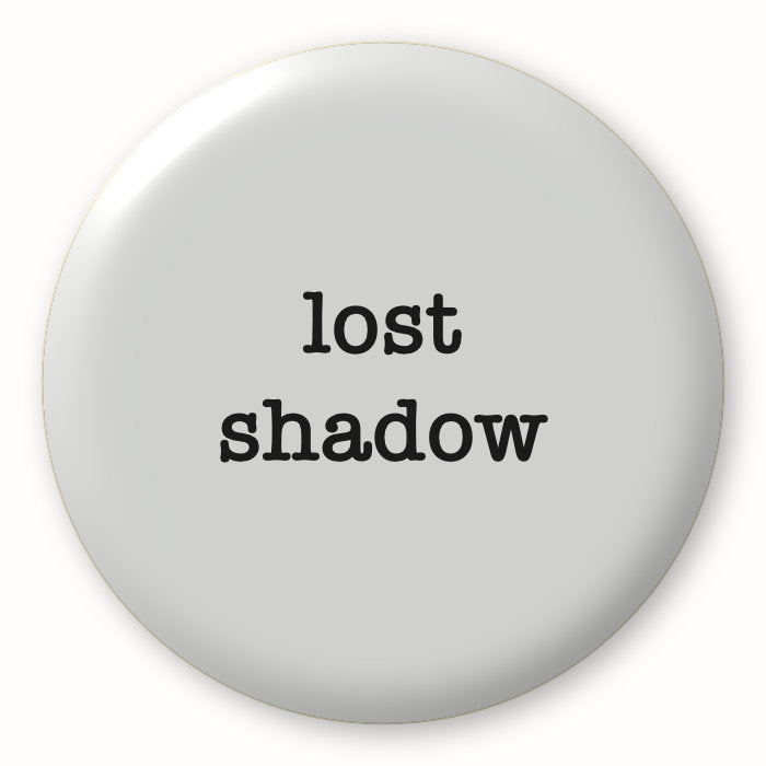 Lost Shadow (grey) - Tim Holtz Distress by Ranger - Image of a round spot with the colour name in the centre. To coincide with your choice of colour when purchasing Distress Paint, Spray Stain, Oxide Spray, Ink Pad, Oxide Ink Pad, Reinker, Oxide Reinker, Embossing Glaze, or Archival Reinker from Art by Jenny Online Shop in Australia. Please note, while we have taken care to show a close representation, the colour may vary between screens or different mediums (inks, oxides, etc).