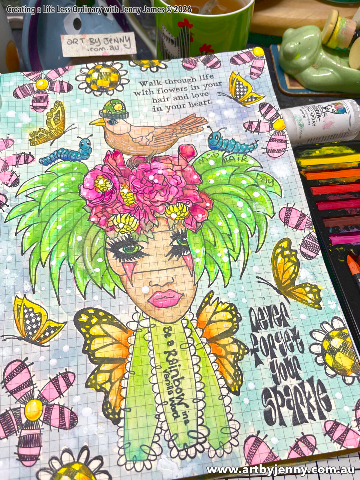 Never Forget Your Sparkle - Stamping a Scene with Art by Jenny . an art journal page in Dylusions Ledger Journal by Jenny James, made using Dylusions Sprays and Distress Ink Pads, an altered stamped illustration of a woman with butterfly wings and birds, flowers, grubs and butterflies around her. Quotes are "Walk through life with flowers in your hair and love and in your heart", "be a rainbow in a vanilla world", "never forget your sparkle". Photo of overview, finished.