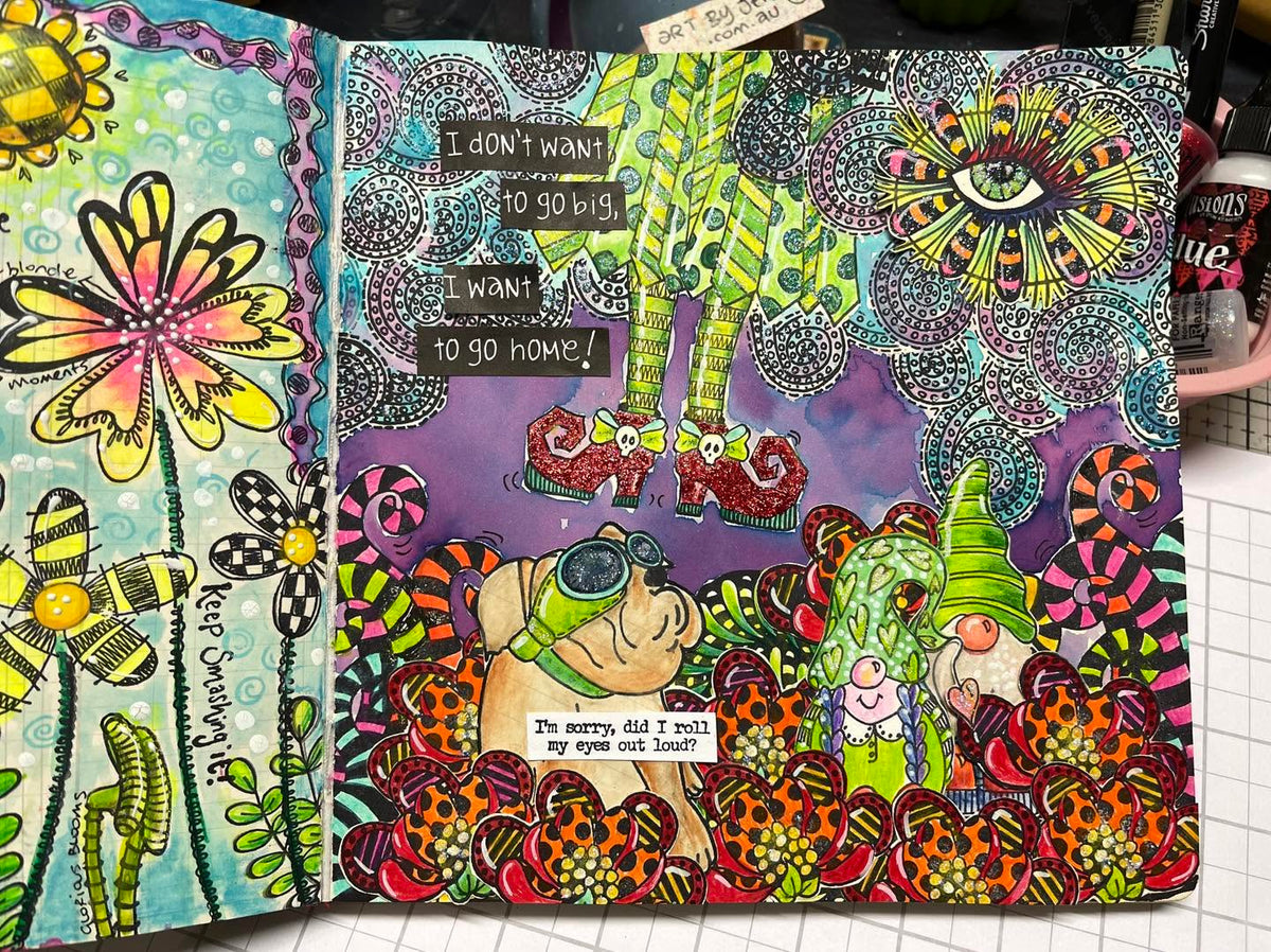 artwork by Jenny James of 'Art by Jenny', created using Dylusions Ink Sprays to colour and paint images in a Witches of Oz scene, stamped using Dylusions Rubber Stamps of legs, shoes, eye, dog, gnomes, swirls and foliage. Made inside a Dyan Reaveley Creative Square Ledger Journal. Colours used are greens, purples, reds, oranges and blues.