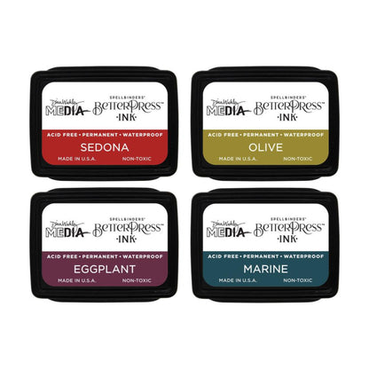 Earthy - BPI054 . Dina Wakley MEdia Mini Ink Pad Set of 4 (four) colours - Sedona, Olive, Eggplant, Marine (one of each). Dina Wakley's BetterPress inks are a specially formulated slow drying Archival Ink made by Ranger for Dina and Spellbinders Paper Arts. The BetterPress ink is a wetter and slower drying ink, giving you more time to layer and print with BetterPress metal plates and etched dies. Photo of the 4 closed ink pads showing lid label.