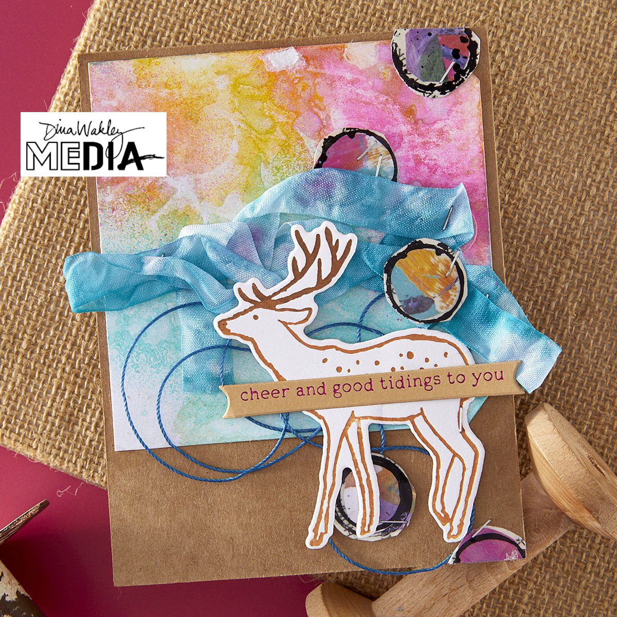 Wonderful Christmas Card made by Dina Wakley using Spellbinder Paper Arts BetterPress Plates and Embossing Folder . Use the designs in mixed media, cardmaking, journaling, scrapbooking and visual arts. Dina's Spellbinders sets include festive designs of birds, baubles, heartfelt messages, holly and berries, spots, crescent moon, reindeer, foliage and stars. All the DWM metal embossing and printing plates can to be used together or separately to create dimension with or without ink. Enjoy!