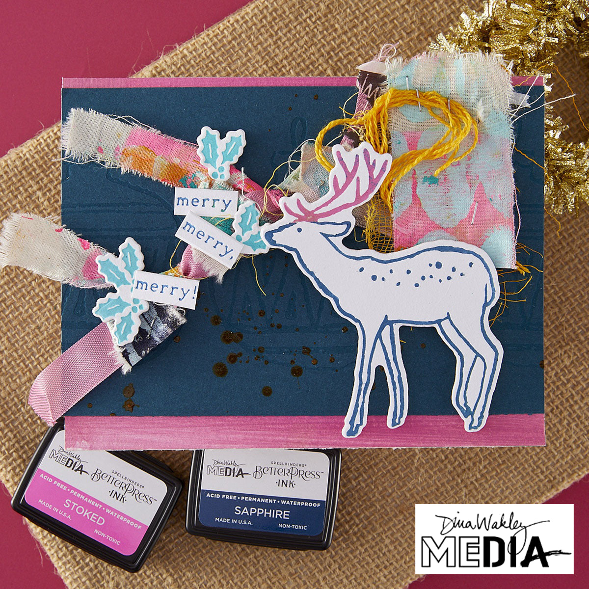 Wonderful Christmas Card made by Dina Wakley using Spellbinder Paper Arts BetterPress Plates and Embossing Folder . Use the designs in mixed media, cardmaking, journaling, scrapbooking and visual arts. Dina's Spellbinders sets include festive designs of birds, baubles, heartfelt messages, holly and berries, spots, crescent moon, reindeer, foliage and stars. All the DWM metal embossing and printing plates can to be used together or separately to create dimension with or without ink. Enjoy!