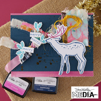 Wonderful Christmas Card made by Dina Wakley using Spellbinder Paper Arts BetterPress Plates and Embossing Folder . Use the designs in mixed media, cardmaking, journaling, scrapbooking and visual arts. Dina's Spellbinders sets include festive designs of birds, baubles, heartfelt messages, holly and berries, spots, crescent moon, reindeer, foliage and stars. All the DWM metal embossing and printing plates can to be used together or separately to create dimension with or without ink. Enjoy!