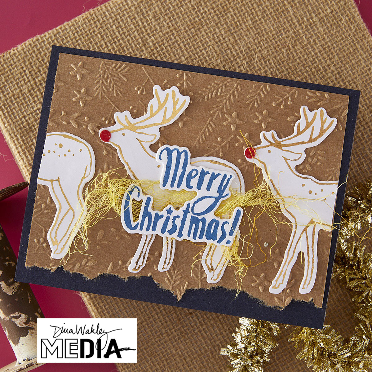 Wonderful Christmas Card made by Dina Wakley using Spellbinder Paper Arts BetterPress Plates and Embossing Folder . Use the designs in mixed media, cardmaking, journaling, scrapbooking and visual arts. Dina's Spellbinders sets include festive designs of birds, baubles, heartfelt messages, holly and berries, spots, crescent moon, reindeer, foliage and stars. All the DWM metal embossing and printing plates can to be used together or separately to create dimension with or without ink. Enjoy!