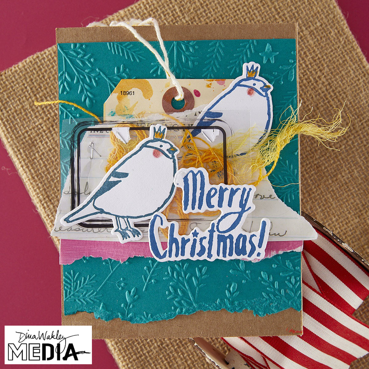 Wonderful Christmas Card made by Dina Wakley using Spellbinder Paper Arts BetterPress Plates and Embossing Folder . Use the designs in mixed media, cardmaking, journaling, scrapbooking and visual arts. Dina's Spellbinders sets include festive designs of birds, baubles, heartfelt messages, holly and berries, spots, crescent moon, reindeer, foliage and stars. All the DWM metal embossing and printing plates can to be used together or separately to create dimension with or without ink. Enjoy!