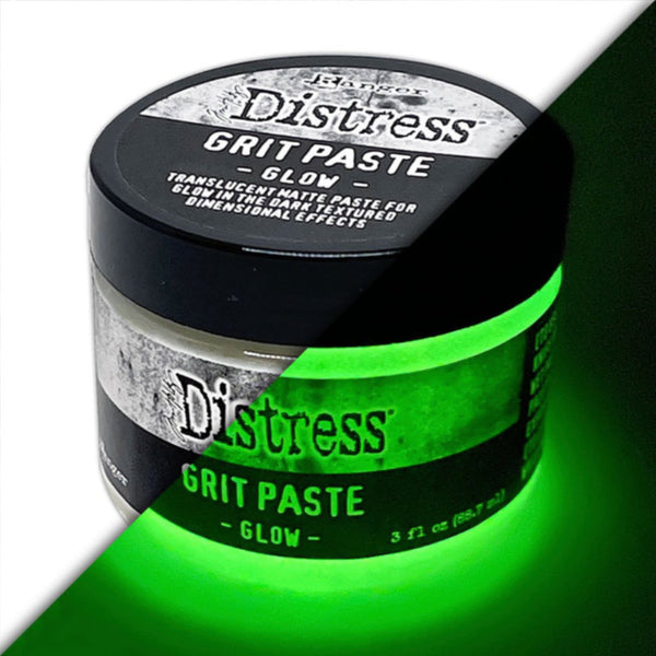 Grit Paste - Glow ... Creamy Translucent Gritty Matte Paste that Glows in the Dark - by Tim Holtz Distress ... dimensional texturised effect paste for mixed media and visual arts, in a 3 fl oz (88.7ml) jar. Made by Ranger.   Tim Holtz Distress Grit Paste in Glow is a creamy translucent dimensional texturised (gritty, sandy) medium with glow in the dark magical properties, designed for creativity and mixed media. It will dry on a variety of visual arts surfaces. Image of the jar with a green glow.