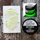 Grit Paste - Glow ... Creamy Translucent Gritty Matte Paste that Glows in the Dark - by Tim Holtz Distress ... dimensional texturised effect paste for mixed media and visual arts, in a 3 fl oz (88.7ml) jar. Made by Ranger.   Tim Holtz Distress Grit Paste in Glow is a creamy translucent dimensional texturised (gritty, sandy) medium with glow in the dark magical properties, designed for creativity and mixed media. It will dry on a variety of visual arts surfaces. Sample of the paste with the jar.