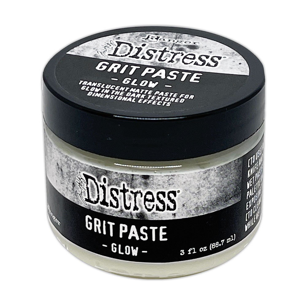 Grit Paste - Glow ... Creamy Translucent Gritty Matte Paste that Glows in the Dark - by Tim Holtz Distress ... dimensional texturised effect paste for mixed media and visual arts, in a 3 fl oz (88.7ml) jar. Made by Ranger.   Tim Holtz Distress Grit Paste in Glow is a creamy translucent dimensional texturised (gritty, sandy) medium with glow in the dark magical properties, designed for creativity and mixed media. It will dry on a variety of visual arts surfaces. Image of the jar with a green glow.