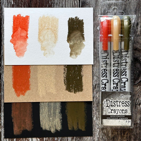 Distress Pearlescent Crayons - Halloween Set 5 ... by Tim Holtz... Limited Edition, seasonal colours of pearlescent shimmery pigment mica fusion in a solid watersoluble crayon in a twist-style barrel with lid. This set has 3 (three) colours (one of each) - Mulled Cider, Unravelled, Fallen Acorn.   Tim Holtz Distress Mica Pearl Crayons in these seasonal colours add beautiful pearlescent colourful layers to your artwork.  TSHK84341. 