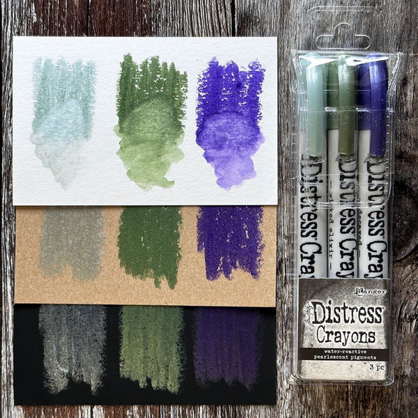Distress Pearlescent Crayons - Halloween Set 6 ... by Tim Holtz... Limited Edition, seasonal colours of pearlescent shimmery pigment mica fusion in a solid watersoluble crayon in a twist-style barrel with lid. This set has 3 (three) colours (one of each) - Phantom Mist, Specimen, Ominous Twilight.   Tim Holtz Distress Mica Pearl Crayons in these seasonal colours add beautiful pearlescent colourful layers to your artwork.  TSHK84358