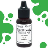 Dyan's Dylusions Archival Ink Reinkers by Ranger, are bottles with fine tip nozzles containing 18ml (.5 fl oz) of an all-purpose ink which dries on most surfaces (paper, card, wood, fabric, vellum, tissue, stone, transparencies (given time to dry) and Yupo. Use to top up your dried well loved Dylusions Archival Mini Ink Pad (sold separately in sets). Image showing Cut Grass.