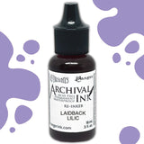 Dyan's Dylusions Archival Ink Reinkers by Ranger, are bottles with fine tip nozzles containing 18ml (.5 fl oz) of an all-purpose ink which dries on most surfaces (paper, card, wood, fabric, vellum, tissue, stone, transparencies (given time to dry) and Yupo. Use to top up your dried well loved Dylusions Archival Mini Ink Pad (sold separately in sets). Image showing Laidback Lilac