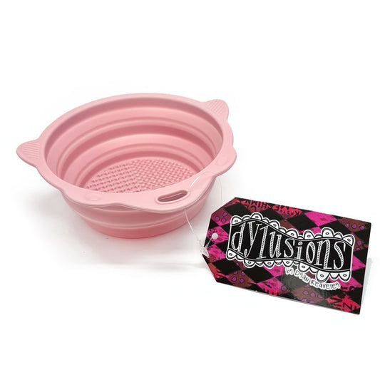 Pink Collapsible Brush Cleaning Bowl - Designed by Dyan Reaveley for Dylusions and Ranger. To use, pull the sides up to create a bowl. Pour in your water or brush cleaner. Swish your brushes around using the textured plate on the base to encourage the bristles to release the paint. Wipe off the brush with your painting rag. Ue the shaped sides to lean a brush so it doesn't roll away. Photo of the bowl open.