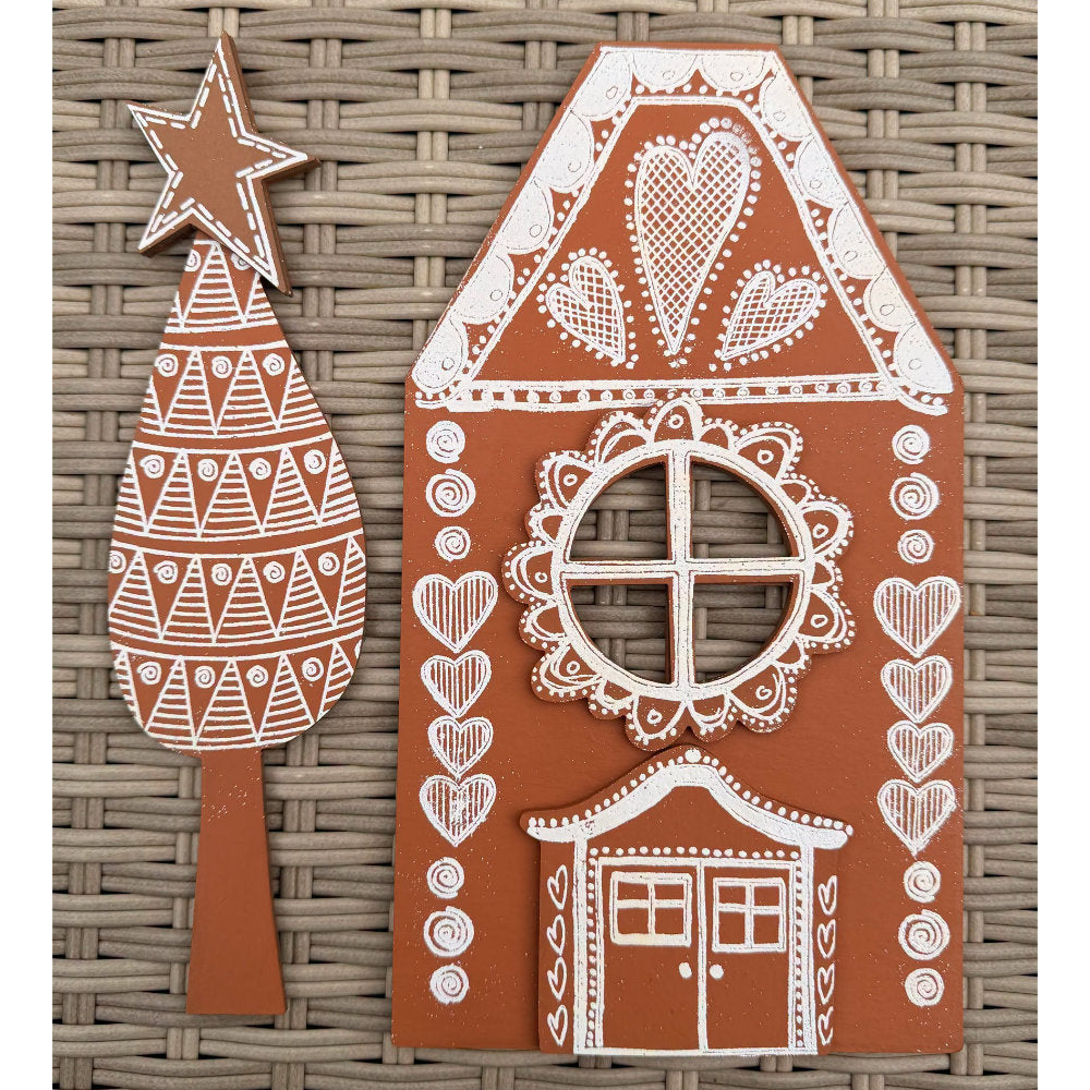 Dyan Reaveley's Dylusions Stampers Anonymous arty crafty example made by Dyan - a gingerbread house and tree with star made with a Village Cutout Artboard kit using Dylusions red rubber art stamps, white fine embossing powder and a little heat to melt the powder to create a glazed faux enamel finish.