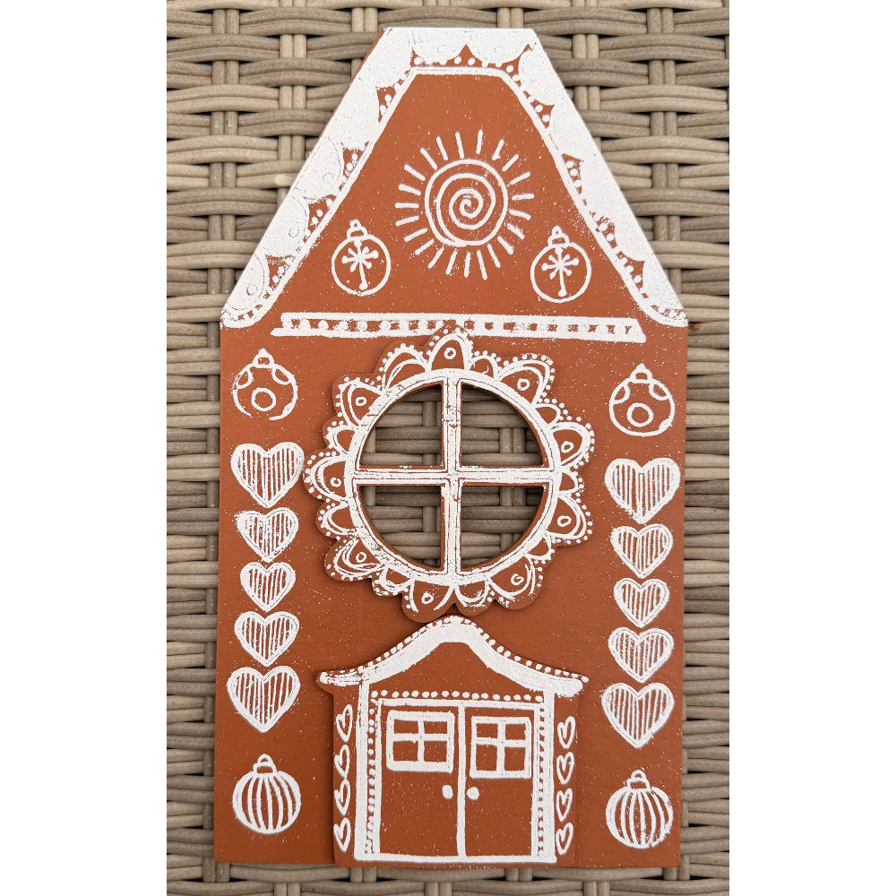 Dyan Reaveley's Dylusions Stampers Anonymous arty crafty example made by Dyan - a gingerbread house made with a Village Cutout Artboard kit using Dylusions red rubber art stamps, white fine embossing powder and a little heat to melt the powder to create a glazed faux enamel finish.