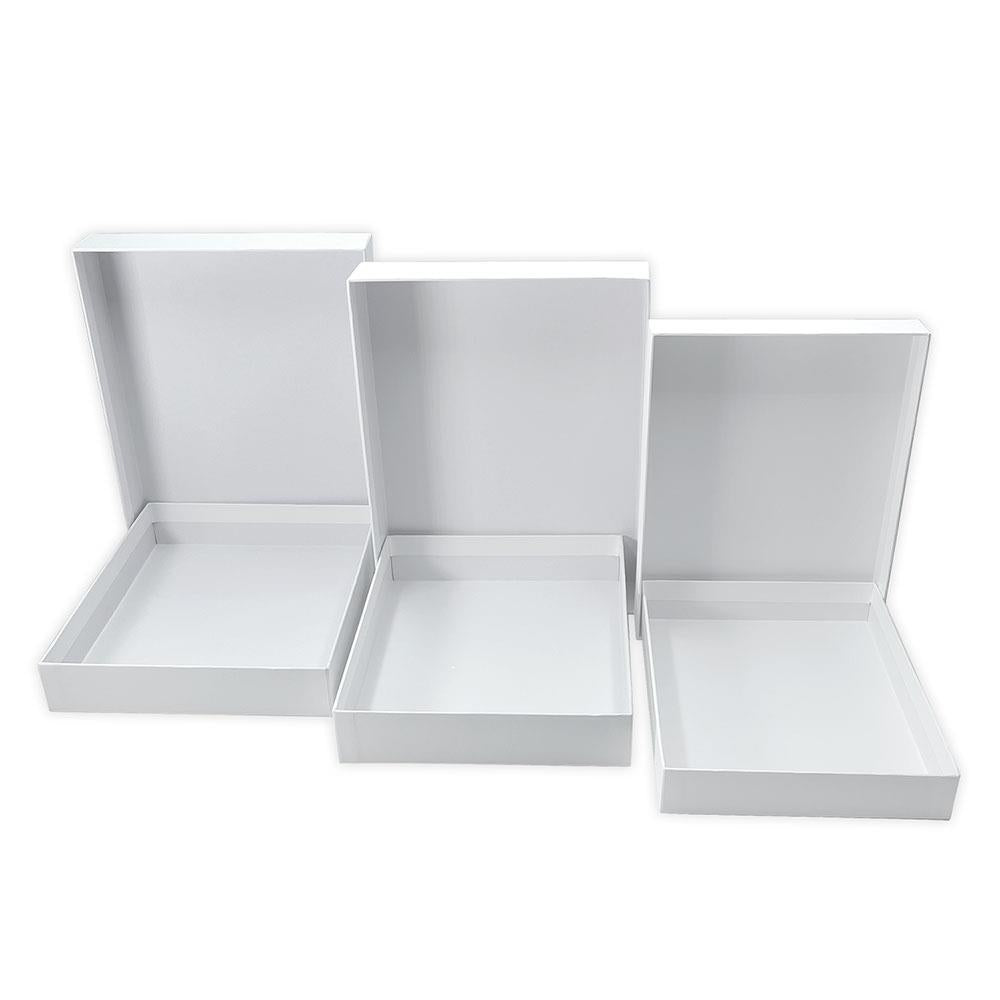 Nesting Boxes - White, 3 Boxes or 6 Trays ... Dyan Reaveley's Dylusions and Ranger.&nbsp; Dyan's Dylusions Nesting Boxes are a set of 6 (six) trays made of durable white board with reinforced corners which fit perfectly within each other in a stack. Alter and use as storage or gifts for friends and family. Photo of a stack of 6 open trays.