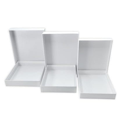 Nesting Boxes - White, 3 Boxes or 6 Trays ... Dyan Reaveley's Dylusions and Ranger.&nbsp; Dyan's Dylusions Nesting Boxes are a set of 6 (six) trays made of durable white board with reinforced corners which fit perfectly within each other in a stack. Alter and use as storage or gifts for friends and family. Photo of a stack of 6 open trays.