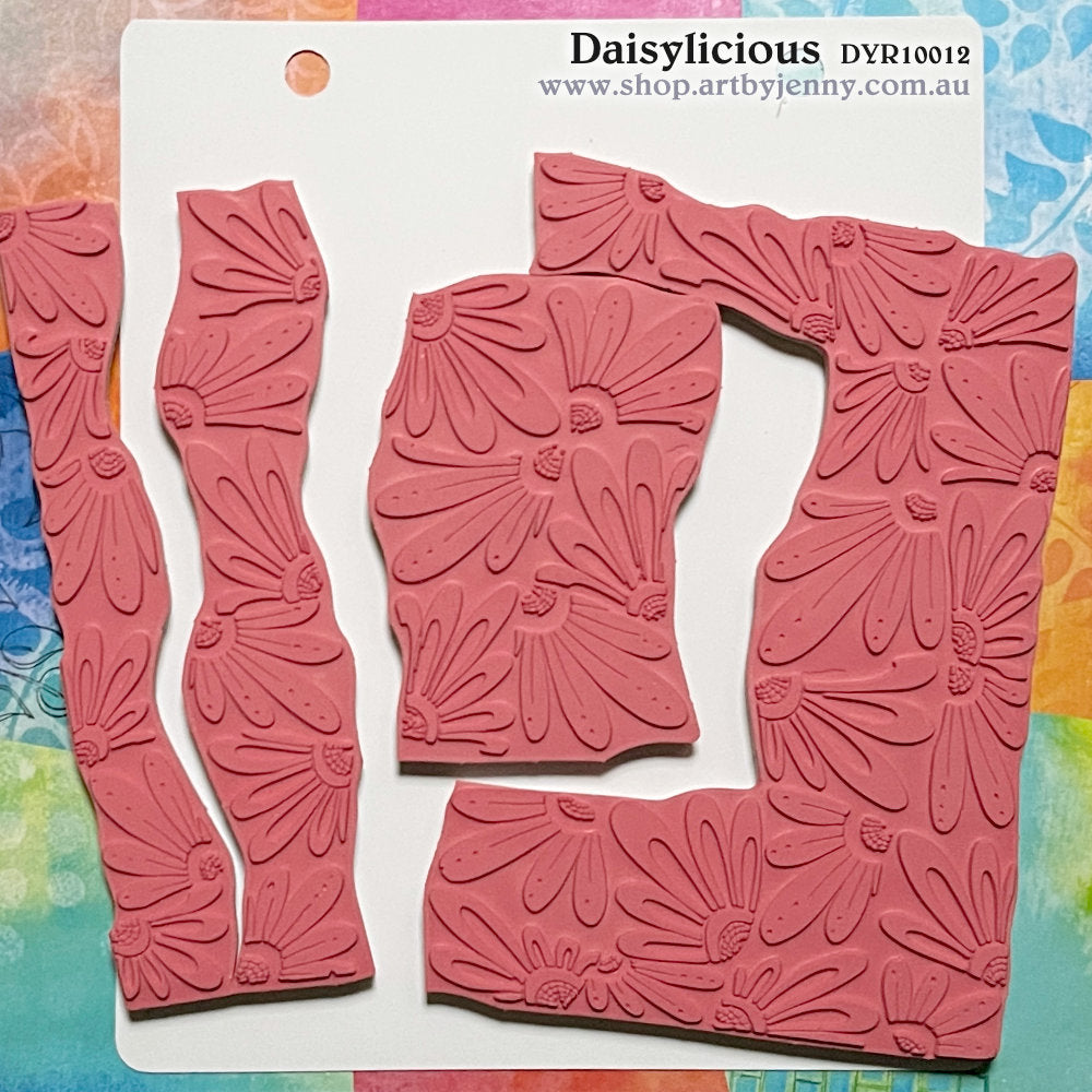 Daisylicious ... rubber stamp set - Dylusions by Dyan Reaveley (DYR10012). 4 (four) designs in one for use in mixed media, art journaling, stamping on fabrics, papercrafts, visual arts of all kinds. &nbsp;Overall size is 6.5 inch square with cutout sections.  Four designs in one, precut and ready to go ... a gathering of flower quartettes (daisies) in two styles, outline and solid. Use as one whole stamp or pull apart to print out each section separately, one at a time.