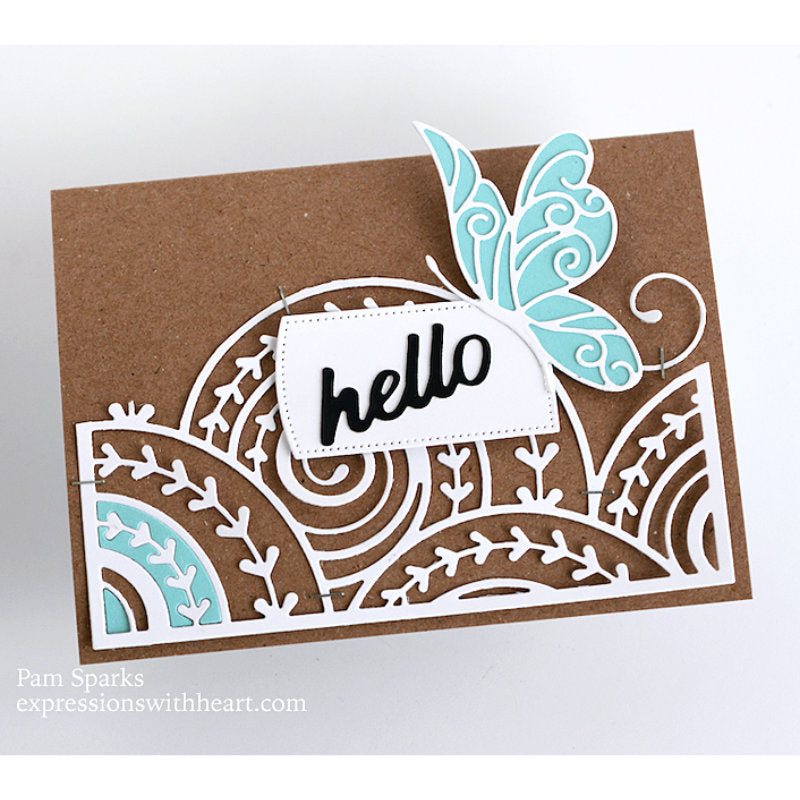 Curlicue Plate - Die Cutting Template by Memory Box (no. MB94698). Spirals and arrows curling and overlapping. Design size 4" x 5 1/4" (10.2cm x 13.3cm). 1 (one) template.  This gorgeous design features overlapping spirals of curls and arrows in fine lines, perfect for layering and adding dimension for cards, scrapbook pages, journaling, mixed media of all kinds. Photo of a card by Pam Sparks, featuring part of the design with a butterfly on kraft.