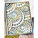 Curlicue Plate - Die Cutting Template by Memory Box (no. MB94698). Spirals and arrows curling and overlapping. Design size 4" x 5 1/4" (10.2cm x 13.3cm). 1 (one) template.  This gorgeous design features overlapping spirals of curls and arrows in fine lines, perfect for layering and adding dimension for cards, scrapbook pages, journaling, mixed media of all kinds. Photo of the beautiful rustic rainbow cutout.