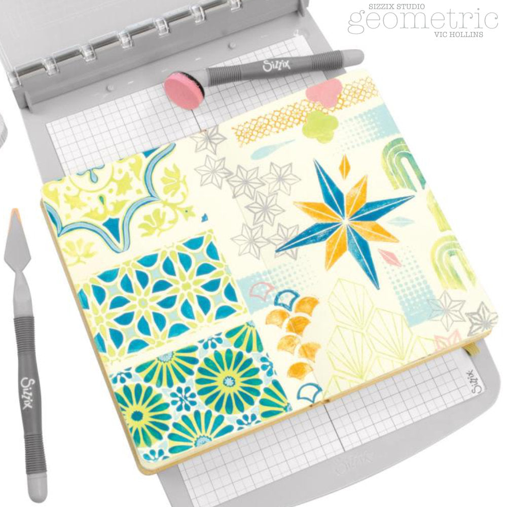 Geometric - Stencils and Stamps ... Sizzix Studio Mixed Media Kit ... by Vic Hollins and Sizzix. Layering art stencils and clear acrylic stamps to use with mixed media, papercrafts, art journaling, visual arts of all kinds. Geometric includes 18 (eighteen) stamp designs and 3 (three) stencil sheets, each with 3 (three) coordinating patterns. Designs feature circles, flowers, scallop corner frame, stars, halftone blocks, diamonds, octagons, scales and more. Photo of an abstract example.