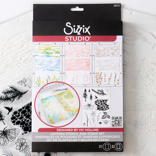 Nature - Stencils and Stamps ... Sizzix Studio Mixed Media Kit ... by Vic Hollins and Sizzix. Layering art stencils and clear acrylic stamps to use for mixed media, papercrafts, art journaling, visual arts of all kinds. Stamps include trees, leaves, branches, path or bubbles, moth with wings outstretched, a ladybeetle (ladybug), bee (top view), flying bird (side view) and stencils feature natural elements like woodgrain, water and wildflowers. Photo of the pack.