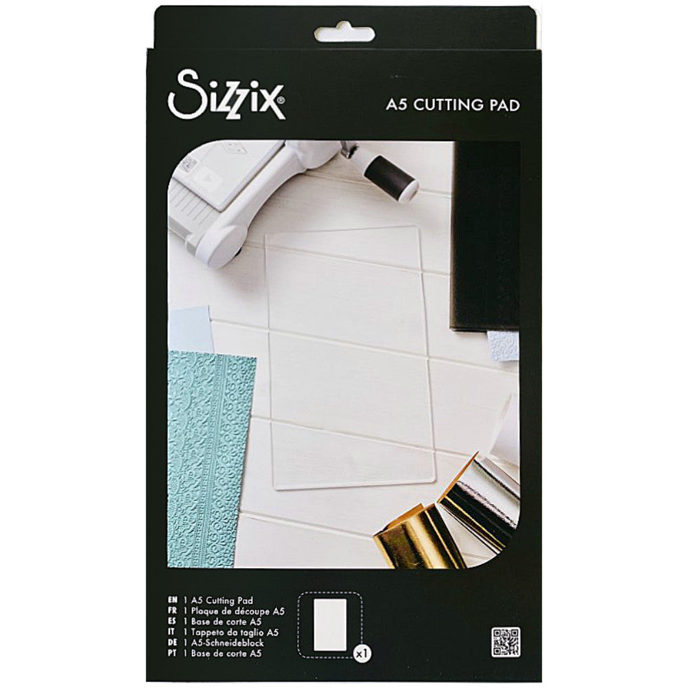 Clear Cutting Pad, A5 ... by Sizzix. An extended size of A5, this is a clear plastic cutting plate to use with Sizzix steel-rule dies, wafer-thin dies and the large A5 embossing folders. Size of the rectangle cutting plate is 10 1/4" x 6 1/8" (260mm x 155mm). This Sizzix Cutting Pad is named "A5" however is longer than A5 at 26cm long. It has been designed to be used with the larger embossing folders as well as all the small to medium sized templates and folders. Product no.666919. Image of packaging.