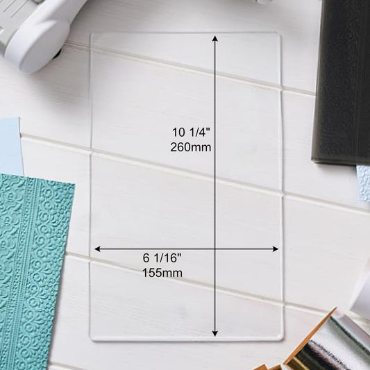 Clear Cutting Pad, A5 ... by Sizzix. An extended size of A5, this is a clear plastic cutting plate to use with Sizzix steel-rule dies, wafer-thin dies and the large A5 embossing folders. Size of the rectangle cutting plate is 10 1/4" x 6 1/8" (260mm x 155mm). This Sizzix Cutting Pad is named "A5" however is longer than A5 at 26cm long. It has been designed to be used with the larger embossing folders as well as all the small to medium sized templates and folders. Product no.666919. Image of dimensions
