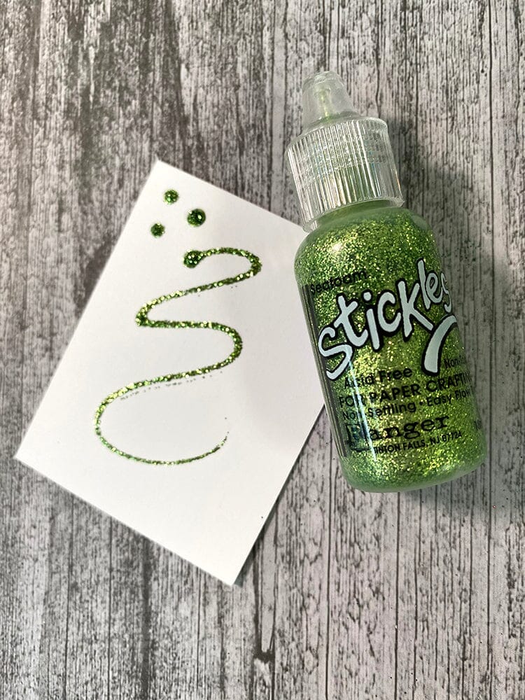 example of Seafoam  - Stickles by Ranger . Add a touch of magical sparkle everywhere you go with this beautiful and easy to use glitter glue! Stickles is a clear medium infused with an abundance of non-settling super fine sparkly glitters in a wild variety of colours. Use on papercrafts, scrapbooking, mixed media, cardmaking, visual arts of all kinds. Each bottle holds 18ml and has a fine tipped nozzle with an easy squeeze application. Once dry on porous surfaces, it is permanent and does not brush off.