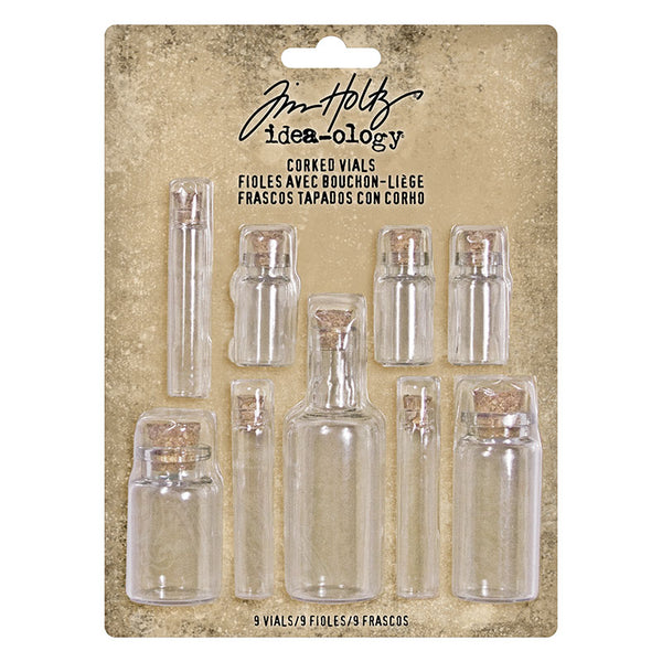 Glass Vials with Corks ... by Tim Holtz Idea-Ology - Use for mixed media, assemblage projects, off-the-page marvels and party decor. Pack of 9 (nine) glass bottles with cork lids. Four different shaped bottles, sizes vary from 1 1/4" to 3" high. Fill with paper flowers, glitter, mica flakes, ephemera, tiny models, eyeballs, baubles, faux lollies, toadstools and moss, anything! Designed by Tim Holtz as part of his Idea-Ology range. Made by Advantus Corp.