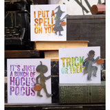 Halloween Night ... Thinlits Die Cutting Templates by Tim Holtz, made by Sizzix (no.666384). 10 (ten) designs to cut out silhouette people carrying brooms and pumpkins. This set of cards features distressed letters with kids having fun.