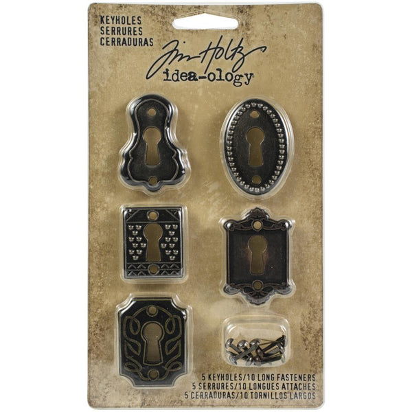 Keyholes, Metal Adornments ... by Tim Holtz Idea-Ology - Realistic metal silver coloured keyhole plates, each with a different style. Use for mixed media, assemblage projects, cardmaking, junk journaling, book making, visual arts. 5 (five) keyholes with 10 (ten) split-pin (brad) fasteners, 1 (one) of each design.   The wonderful vintage styling of these Metal Adornment Keyholes are a vintage silver colour, designed by Tim Holtz to enhance your project with a beautiful unique style. TH92718