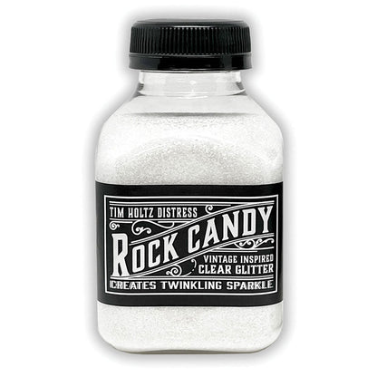 Clear - Rock Candy Distress Dry Glitter - by Tim Holtz and Ranger ... A crystal clear, light sparkly multi-sized fine glitter. Jar contains 4.7oz (133g) jar. 
Tim's 'Clear' Distress Dry Glitter is a vintage inspired, multi-sized fine translucent glitter which creates twinkling sugary sparkle everywhere you go. 