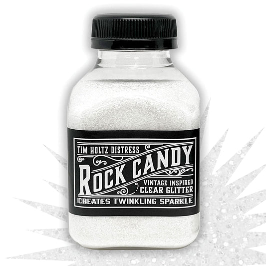 Clear - Rock Candy Distress Dry Glitter - by Tim Holtz and Ranger ... A crystal clear, light sparkly multi-sized fine glitter. Jar contains 4.7oz (133g) jar. 
Tim's 'Clear' Distress Dry Glitter is a vintage inspired, multi-sized fine translucent glitter which creates twinkling sugary sparkle everywhere you go. 