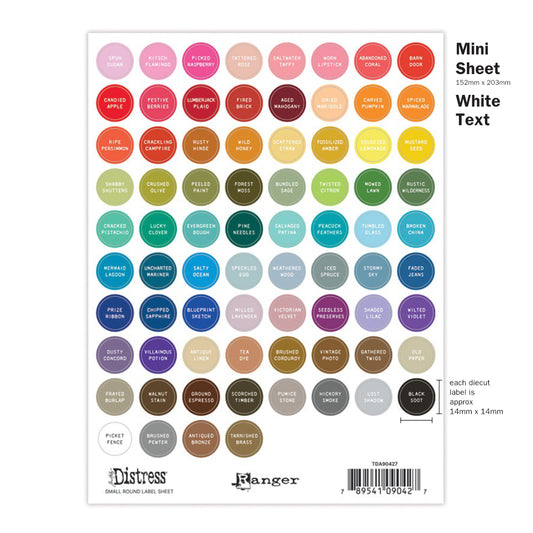 Image showing the Small Sheet of mini spots, circles with white Text. Tim Holtz Distress® Labels are designed in two text colour styles (black or white) to suit your own needs or decor. Each text colour style is available in four designs - small round (for sprays, inside tins or palette trays), large round (for paints, embossing glazes), small rectangle (for mini ink pads, archival ink pads, pencils, crayons, inside storage tins), large rectangle (for regular sized ink pads, crayons). 