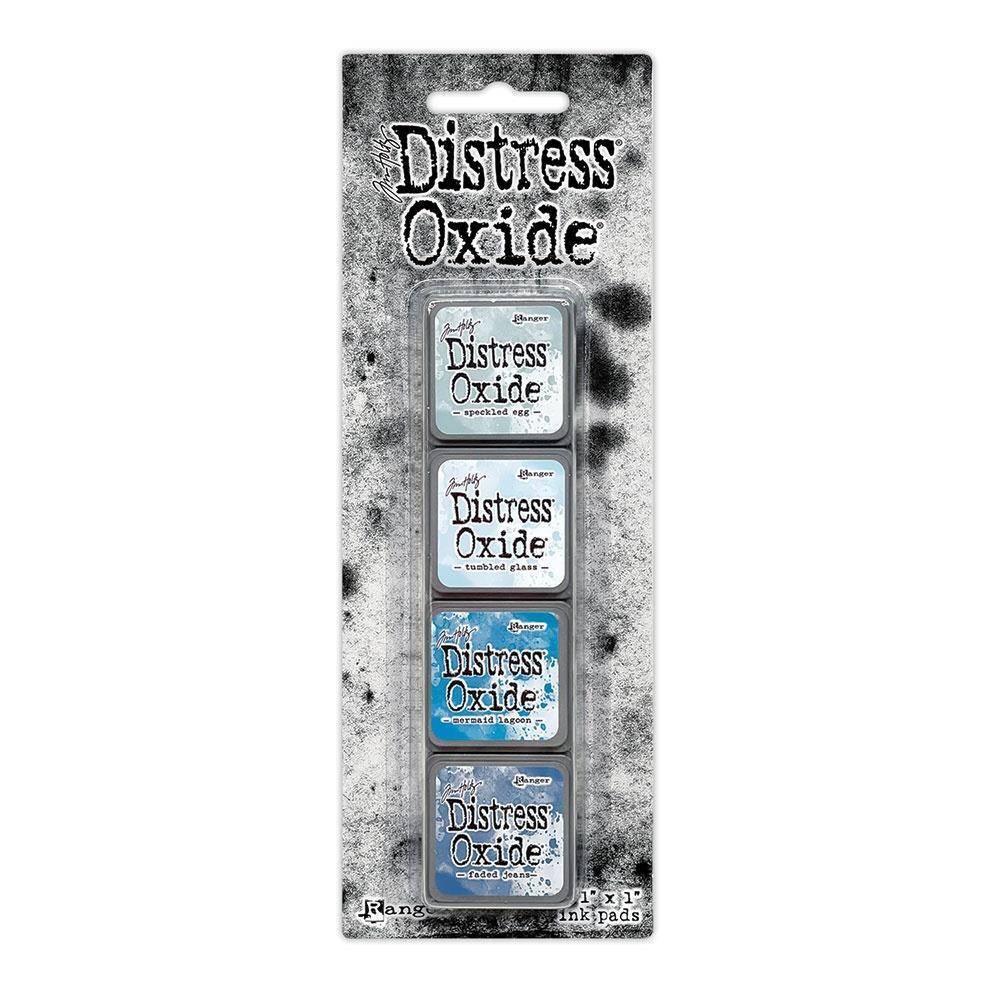 Mini Distress Oxide Ink Pads - Set 10 - by Tim Holtz and Ranger ... featuring water-reactive dye and pigment ink fusion that creates an oxidised effect when spattered, stamped, brushed and or sprayed with water. The colours are opaque and dry with a soft matte finish. Set of 4 (four) colours in Mini Ink Pad Cubes (1"x1"), one of each (TDIK91561).

Colours in this set are ...
- Speckled Egg
- Tumbled Glass
- Mermaid Lagoon
- Faded Jeans
... one of each colour.