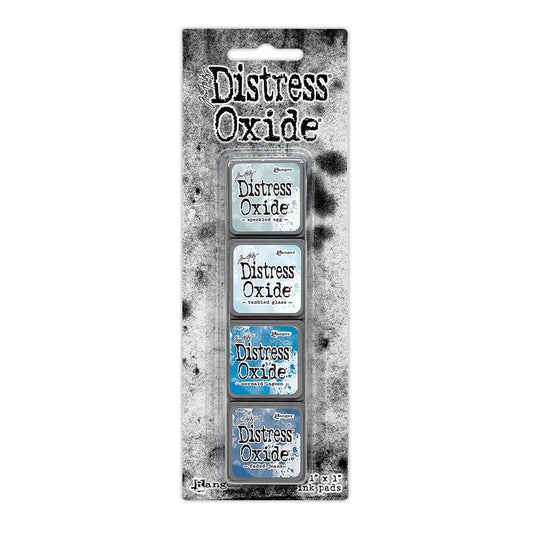 Mini Distress Oxide Ink Pads - Set 10 - by Tim Holtz and Ranger ... featuring water-reactive dye and pigment ink fusion that creates an oxidised effect when spattered, stamped, brushed and or sprayed with water. The colours are opaque and dry with a soft matte finish. Set of 4 (four) colours in Mini Ink Pad Cubes (1"x1"), one of each (TDIK91561).

Colours in this set are ...
- Speckled Egg
- Tumbled Glass
- Mermaid Lagoon
- Faded Jeans
... one of each colour.
