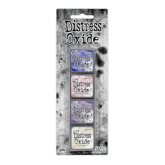 Mini Distress Oxide Ink Pads - Set 11 - by Tim Holtz and Ranger ... featuring water-reactive dye and pigment ink fusion that creates an oxidised effect when spattered, stamped, brushed and or sprayed with water. The colours are opaque and dry with a soft matte finish. Set of 4 (four) colours in Mini Ink Pad Cubes (1"x1"), one of each (TDIK91578).

Colours in this set are ...
- Blueprint Sketch
- Victorian Velvet
- Dusty Concord
- Old Paper
... one of each colour.