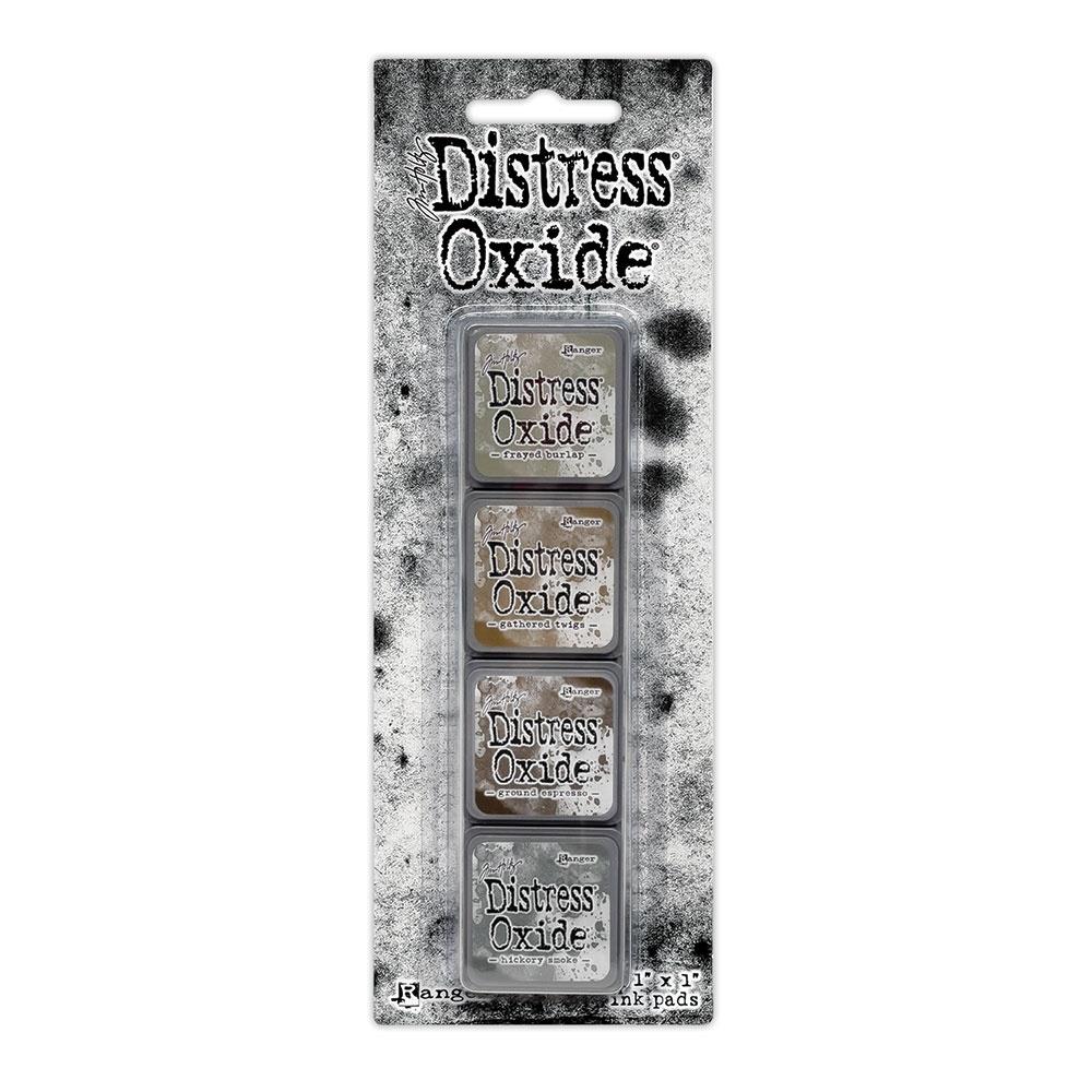 Mini Distress Oxide Ink Pads - Set 12 - by Tim Holtz and Ranger ... featuring water-reactive dye and pigment ink fusion that creates an oxidised effect when spattered, stamped, brushed and or sprayed with water. The colours are opaque and dry with a soft matte finish. Set of 4 (four) colours in Mini Ink Pad Cubes (1"x1"), one of each (TDIK91585).

Colours in this set are ...
- Frayed Burlap
- Gathered Twigs
- Ground Espresso
- Hickory Smoke
... one of each colour.