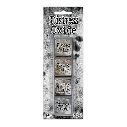 Mini Distress Oxide Ink Pads - Set 12 - by Tim Holtz and Ranger ... featuring water-reactive dye and pigment ink fusion that creates an oxidised effect when spattered, stamped, brushed and or sprayed with water. The colours are opaque and dry with a soft matte finish. Set of 4 (four) colours in Mini Ink Pad Cubes (1"x1"), one of each (TDIK91585).

Colours in this set are ...
- Frayed Burlap
- Gathered Twigs
- Ground Espresso
- Hickory Smoke
... one of each colour.