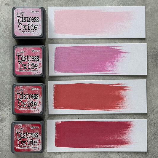 Mini Distress Oxide Ink Pads - Set 1 - by Tim Holtz and Ranger ... featuring water-reactive dye and pigment ink fusion that creates an oxidised effect when spattered, stamped, brushed and or sprayed with water. The colours are opaque and dry with a soft matte finish. Set of 4 (four) colours, one of each (TDIK91479). 
Colours in this set are ...
- Spun Sugar
- Picked Raspberry
- Festive Berries
- Lumberjack Plaid
... one of each colour. Photo of sampled swatches.