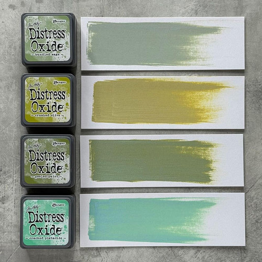 Mini Distress Oxide Ink Pads - Set 3 - by Tim Holtz and Ranger ... featuring water-reactive dye and pigment ink fusion that creates an oxidised effect when spattered, stamped, brushed and or sprayed with water. The colours are opaque and dry with a soft matte finish. Set of 4 (four) colours, one of each (TDIK91493). 
Colours in this set are ...
- Bundled Sage
- Crushed Olive
- Peeled Paint
- Cracked Pistachio
... one of each colour.