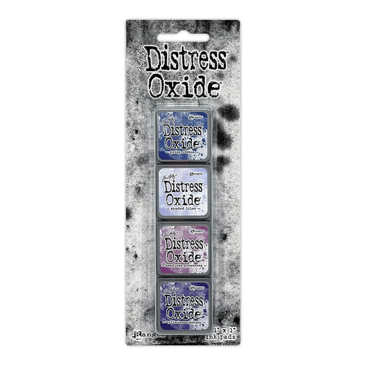 Mini Distress Oxide Ink Pads - Set 5 - by Tim Holtz and Ranger ... featuring water-reactive dye and pigment ink fusion that creates an oxidised effect when spattered, stamped, brushed and or sprayed with water. The colours are opaque and dry with a soft matte finish. Set of 4 (four) colours, one of each (TDIK91516).

Colours in this set are ...
- Prize Ribbon
- Shaded Lilac
- Seedless Preserves
- Villainous Potion
... one of each colour.