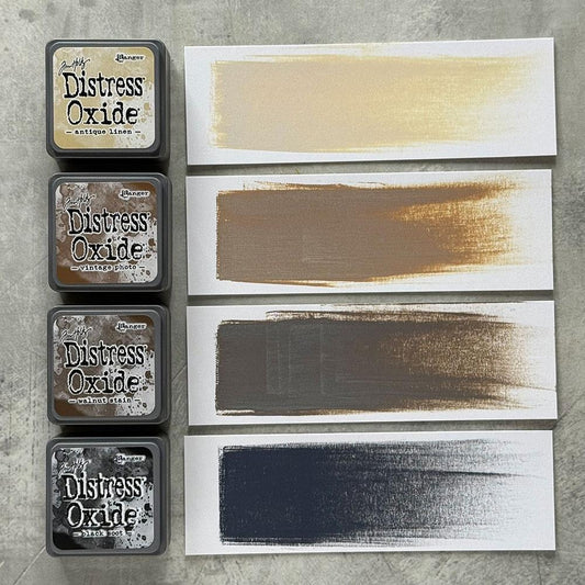 Mini Distress Oxide Ink Pads - Set 6 - by Tim Holtz and Ranger ... featuring water-reactive dye and pigment ink fusion that creates an oxidised effect when spattered, stamped, brushed and or sprayed with water. The colours are opaque and dry with a soft matte finish. Set of 4 (four) colours, one of each (TDIK91523).

Colours in this set are ...
- Antique Linen
- Vintage Photo
- Walnut Stain
- Black Soot
... one of each colour.