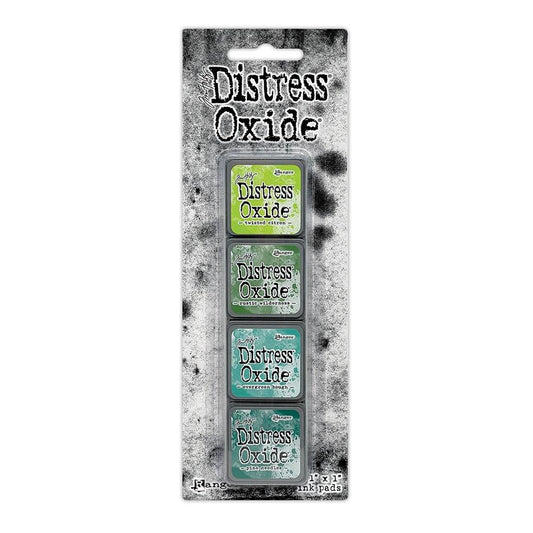 Mini Distress Oxide Ink Pads - Set 9 - by Tim Holtz and Ranger ... featuring water-reactive dye and pigment ink fusion that creates an oxidised effect when spattered, stamped, brushed and or sprayed with water. The colours are opaque and dry with a soft matte finish. Set of 4 (four) colours in Mini Ink Pad Cubes (1"x1"), one of each (TDIK91554).

Colours in this set are ...
- Twisted Citron
- Rustic Wilderness
- Evergreen Bough
- Pine Needles
... one of each colour.